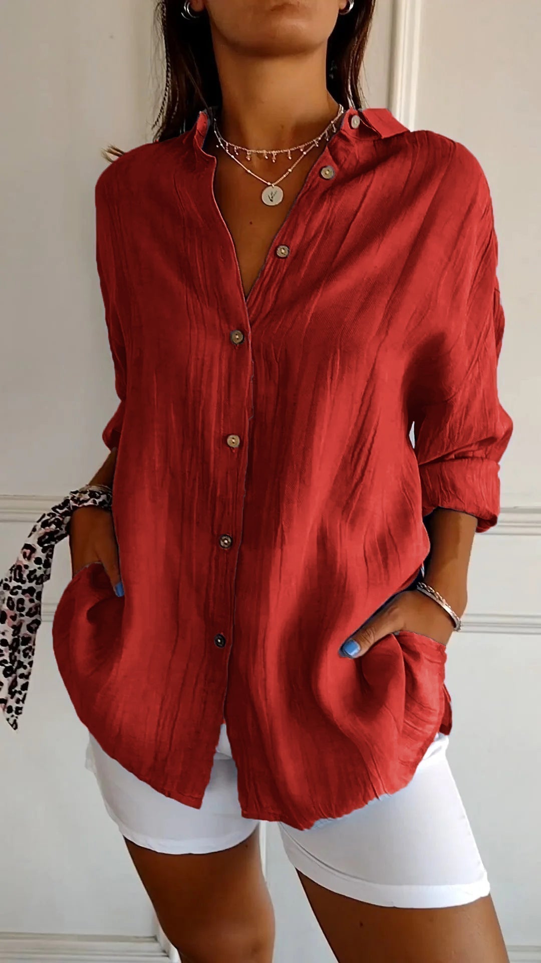 Stylish women's long sleeve button-down top, a must-have for spring fashion and comfort.