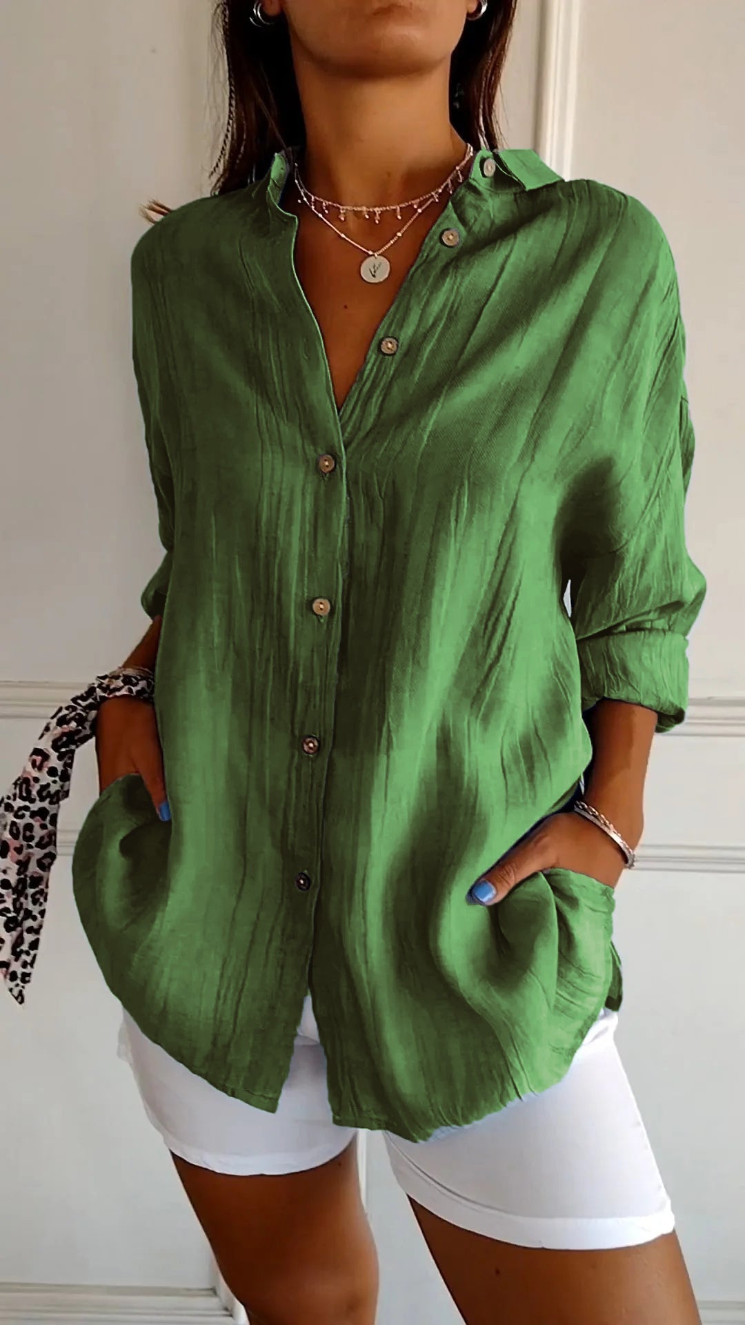 Elegant yet casual women's long sleeve button-down blouse, offering versatile styling options.