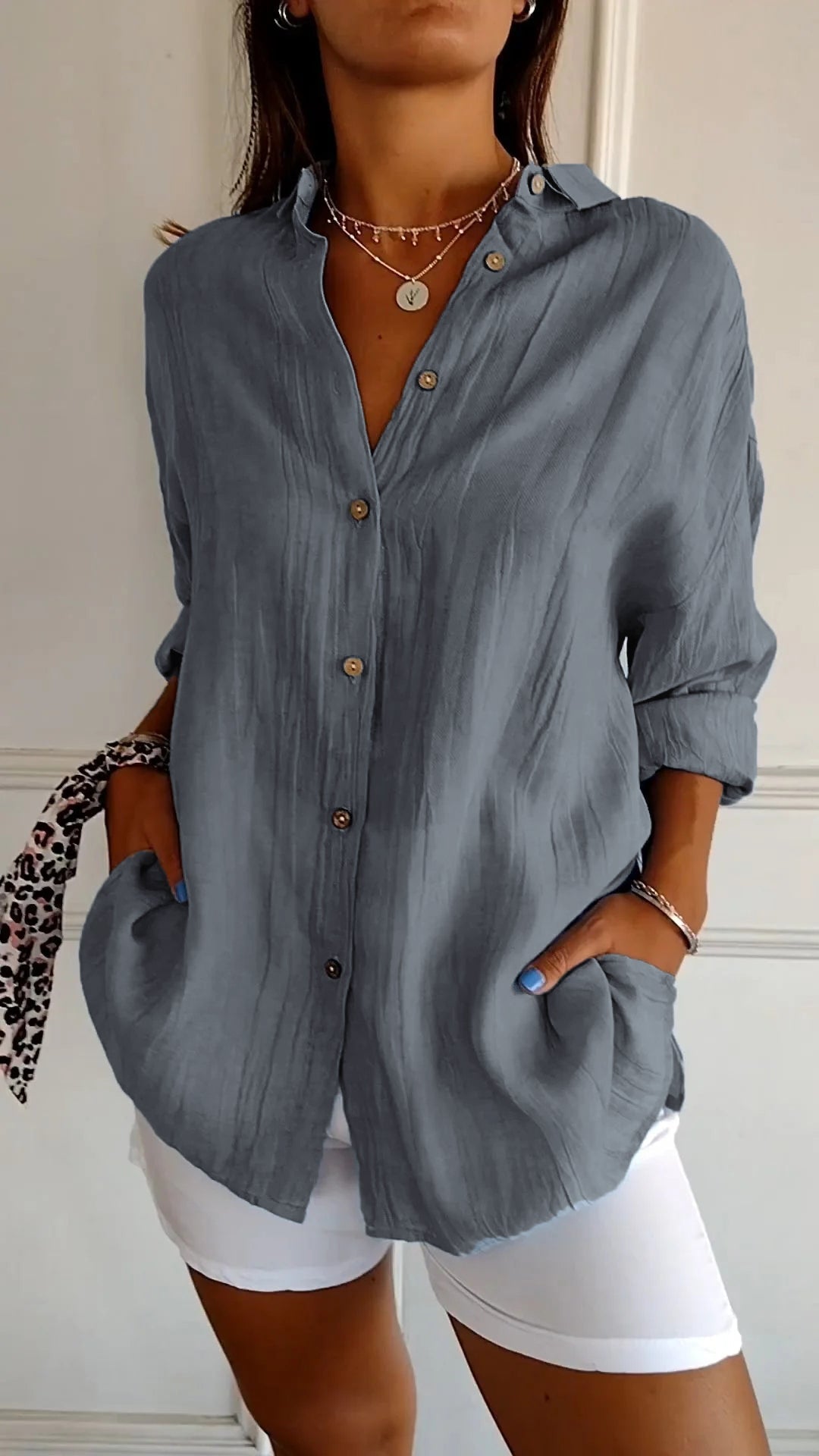 Comfortable women's long sleeve button-down blouse, an elegant choice for office wear.