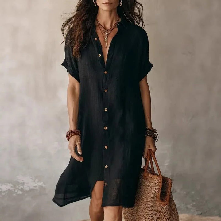 Relaxed fit women's button-down shirt dress, perfect versatile summer fashion. Chic everyday wear.