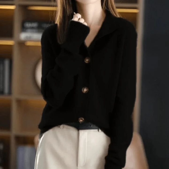 Cozy women's outerwear cardigan, button-front design, stand-collar, and comfortable ribbed cuffs.