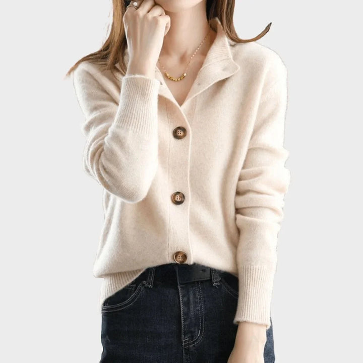 Stylish women's long-sleeve cardigan with button-front, stand-collar, and detailed ribbed cuffs.