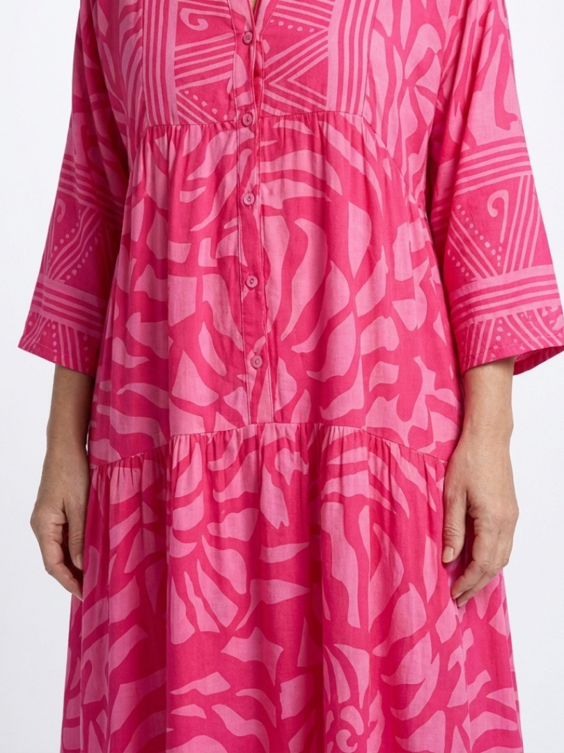 Effortless casual midi dress for women featuring a stylish button front, comfortable relaxed fit & elbow sleeves.