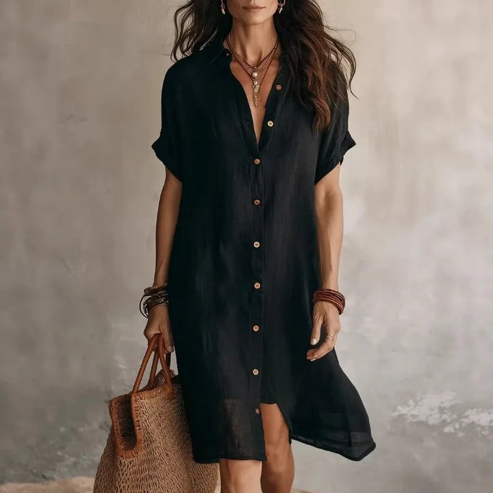 Women's button-front midi shirt dress with short sleeves. Perfect for casual or smart casual occasions, a versatile spring/summer look.