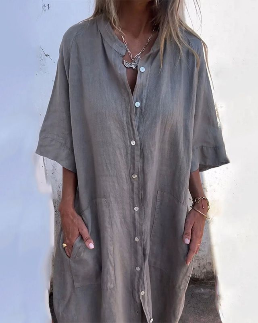 Women's button-front shirt dress with pockets, v-neck, short sleeves, ideal for casual summer style.
