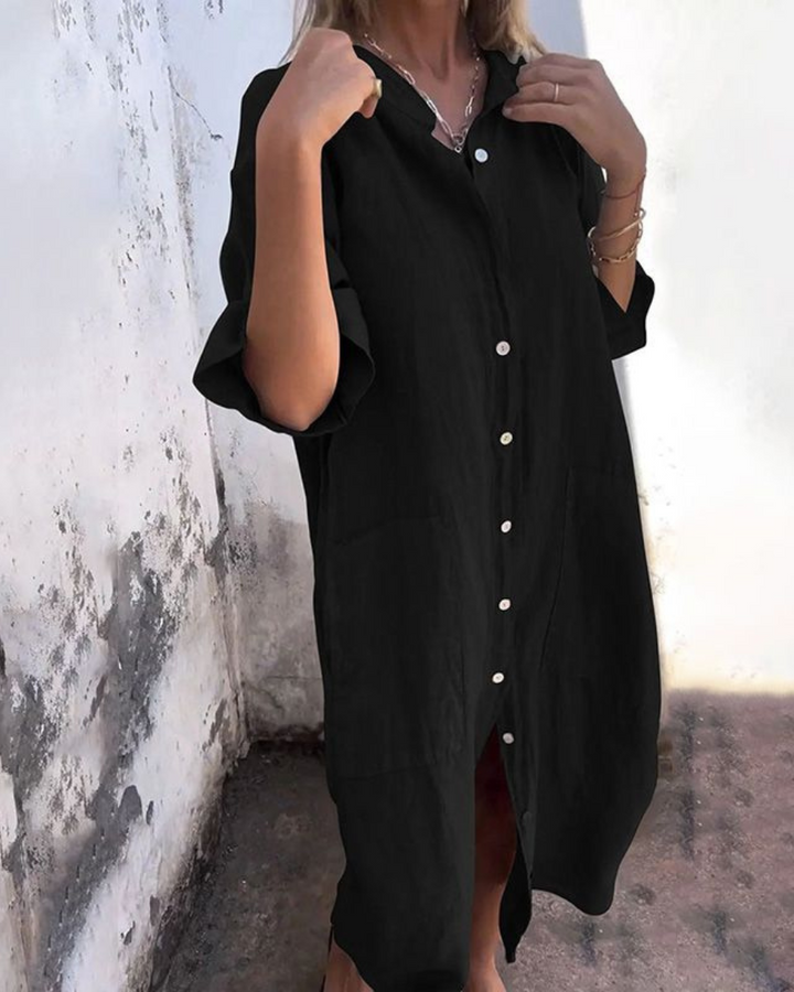 Casual women's button-front shirt dress with pockets, short sleeves, perfect for relaxed summer days.