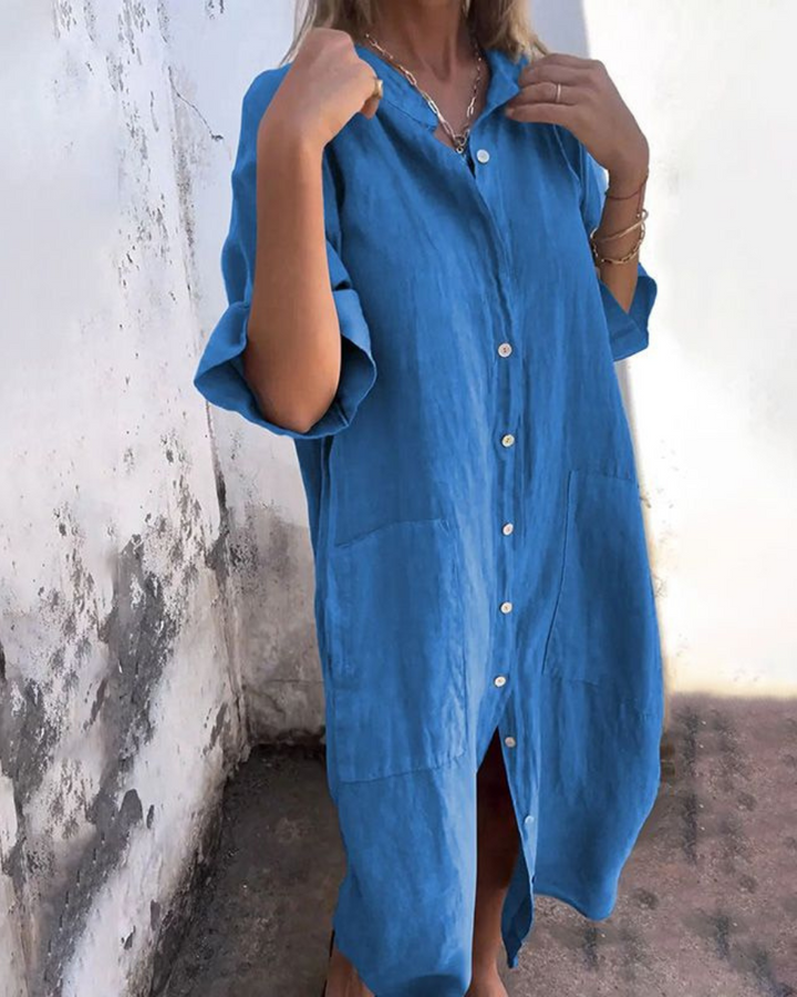 Stylish women's relaxed fit shirt dress, button-front with practical pockets, comfortable for everyday wear.