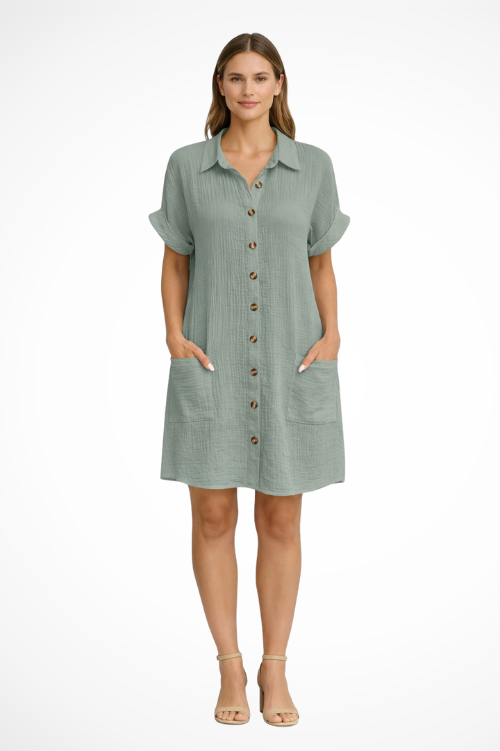 Flowy short sleeve women's sun dress with button front, ideal for beach days, vacation, and relaxed summer style.