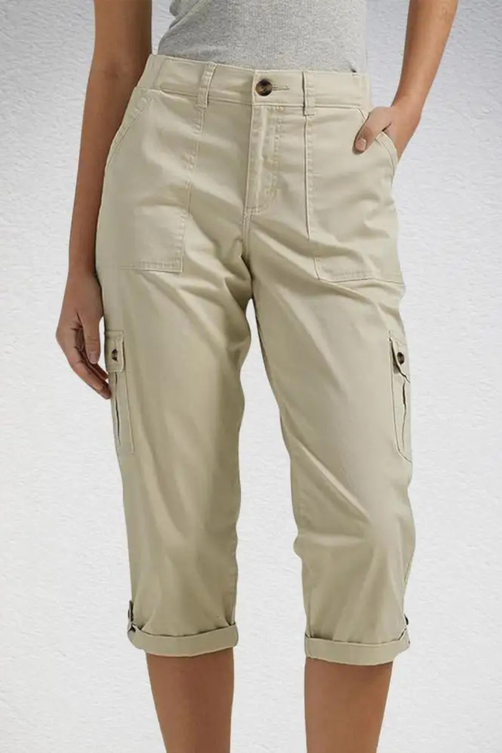 Full length shot of women's trendy cargo cropped trousers, featuring a functional roll-up hem.