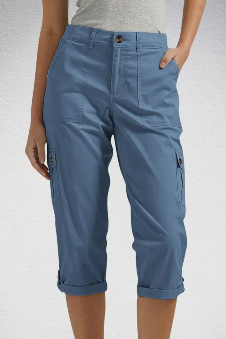 Modern women's cropped cargo pants with roll-up hem, blending utility and fashion for versatile everyday style.