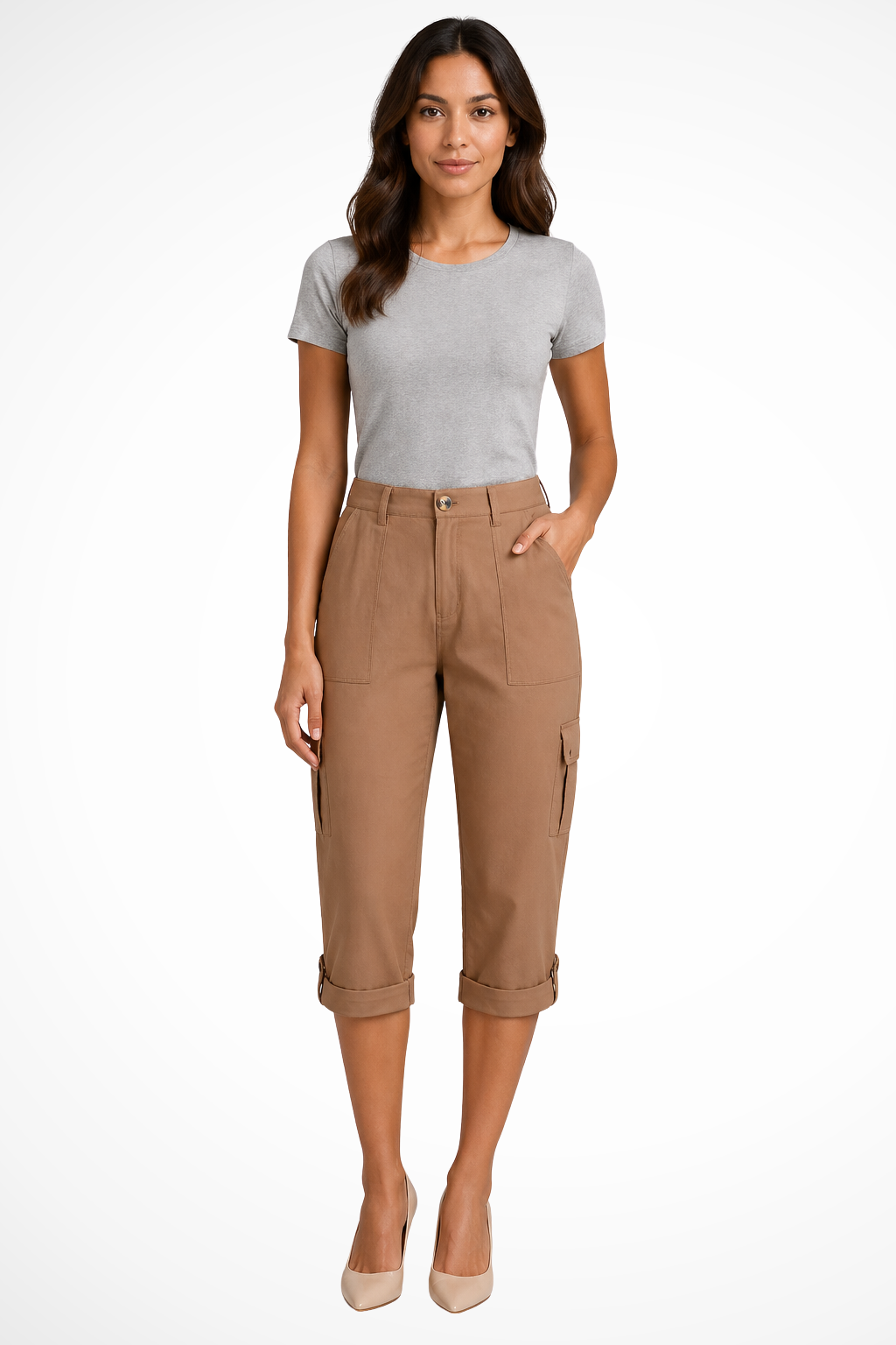 Woman walking in comfortable cropped cargo trousers with roll-up hem, perfect for casual outdoor wear.