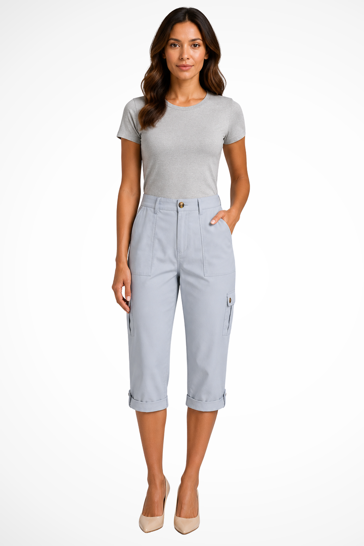 Close-up of women's cargo cropped trousers, highlighting the stylish and adjustable roll-up hem.