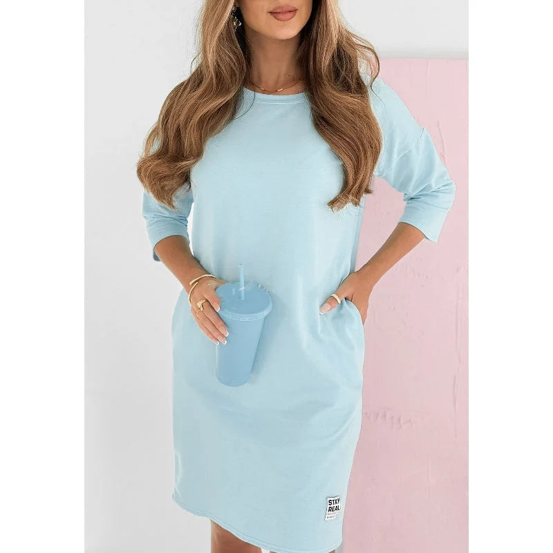 Comfortable women's mini dress, 3/4-sleeve crew neck design with convenient pockets for everyday wear.
