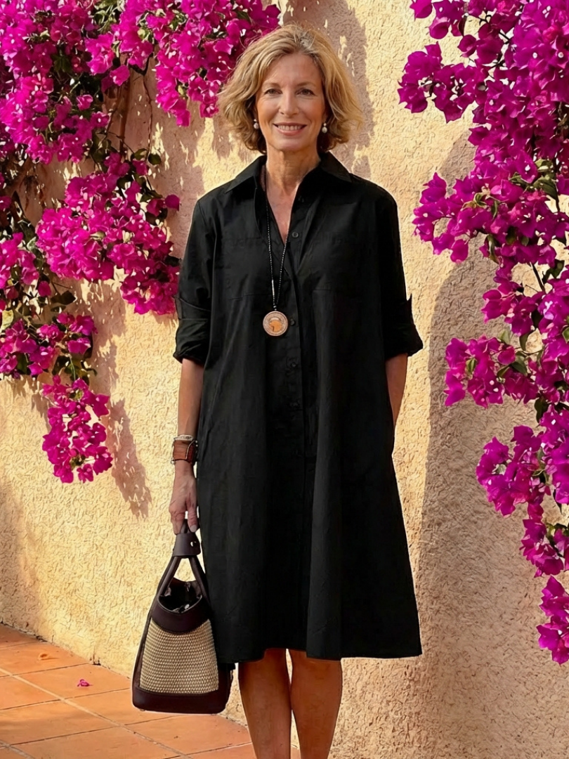Relaxed fit women's midi shirt dress with button front & collar, ideal for summer fashion.