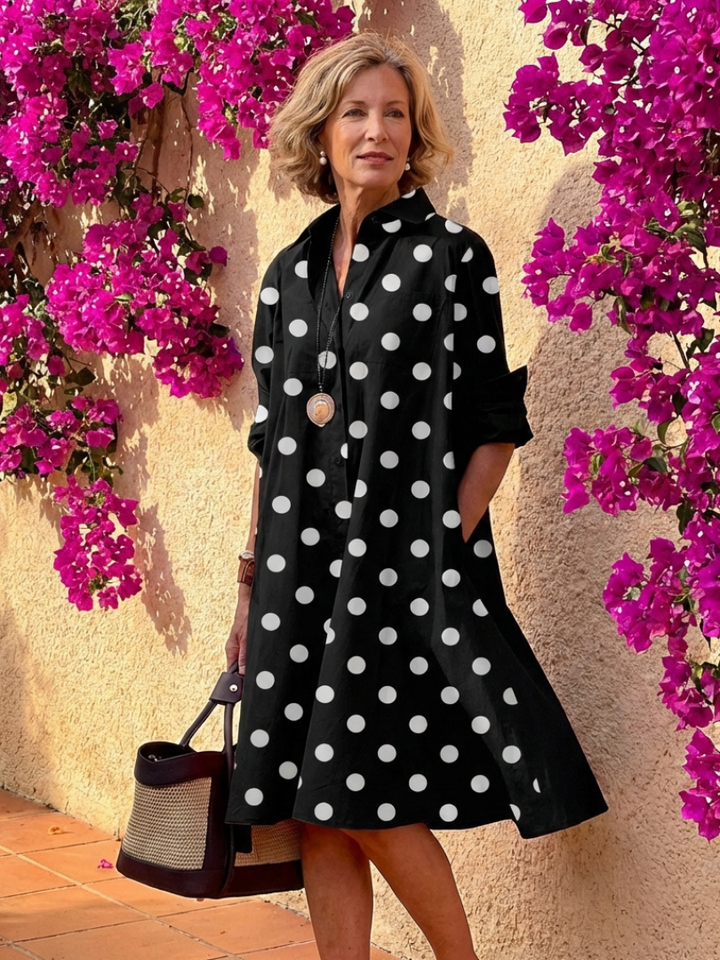 Versatile women's casual midi shirt dress, collared with a full button front, suitable for travel.