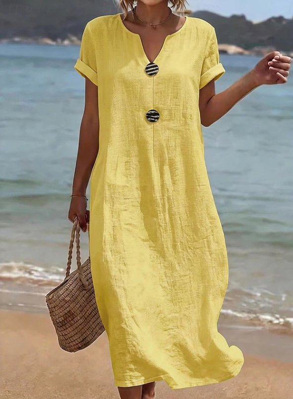 Women's button-down beach maxi dress, a casual and flowy summer style. Relaxed fit for vacation wear.