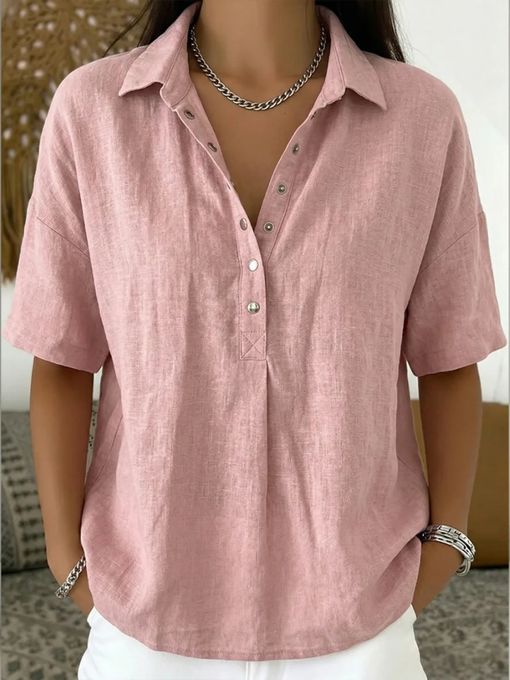 Relaxed fit women's button-up shirt, a chic collared blouse for versatile spring and summer outfits.