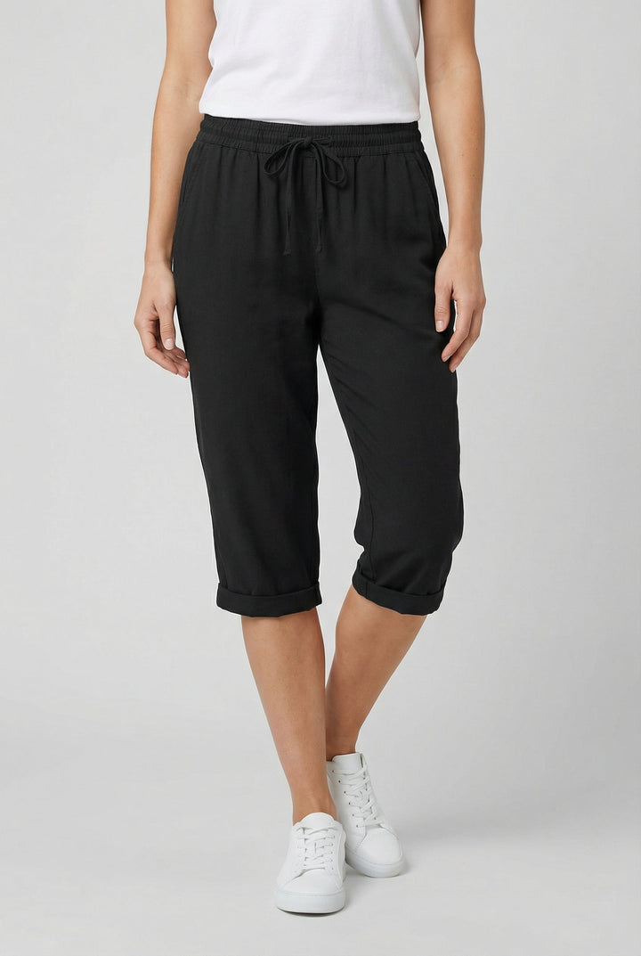 Close-up on the stitching and pocket detail of women's comfortable shorts.