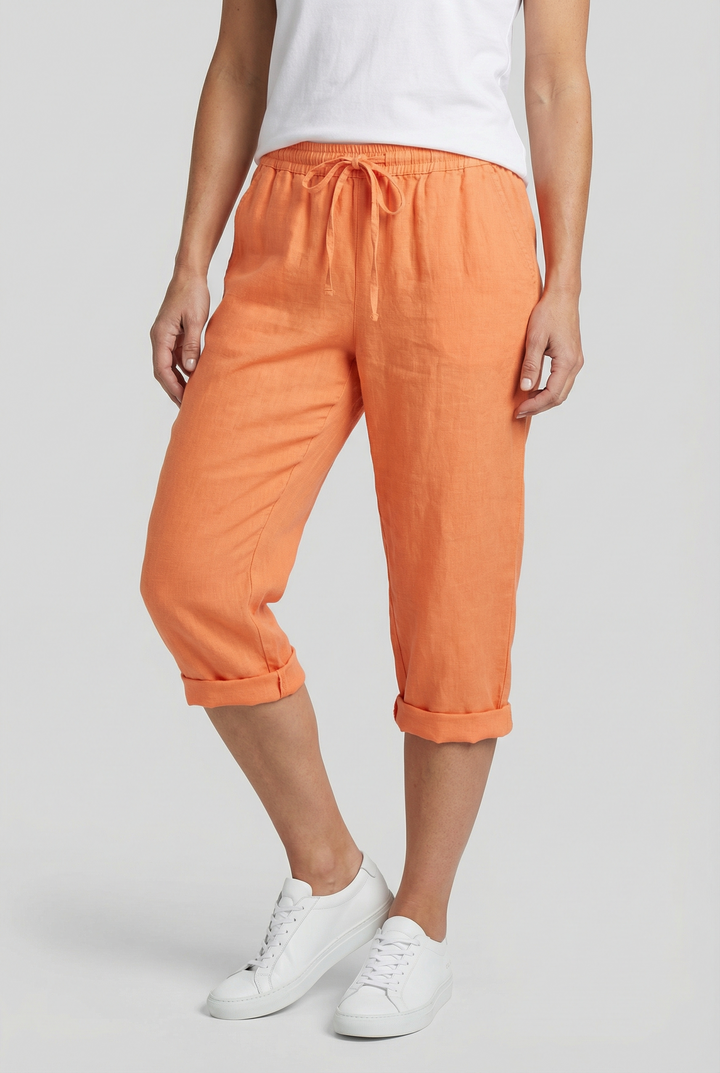 Women's casual shorts in a soft pink hue, highlighting the loose fit comfort.