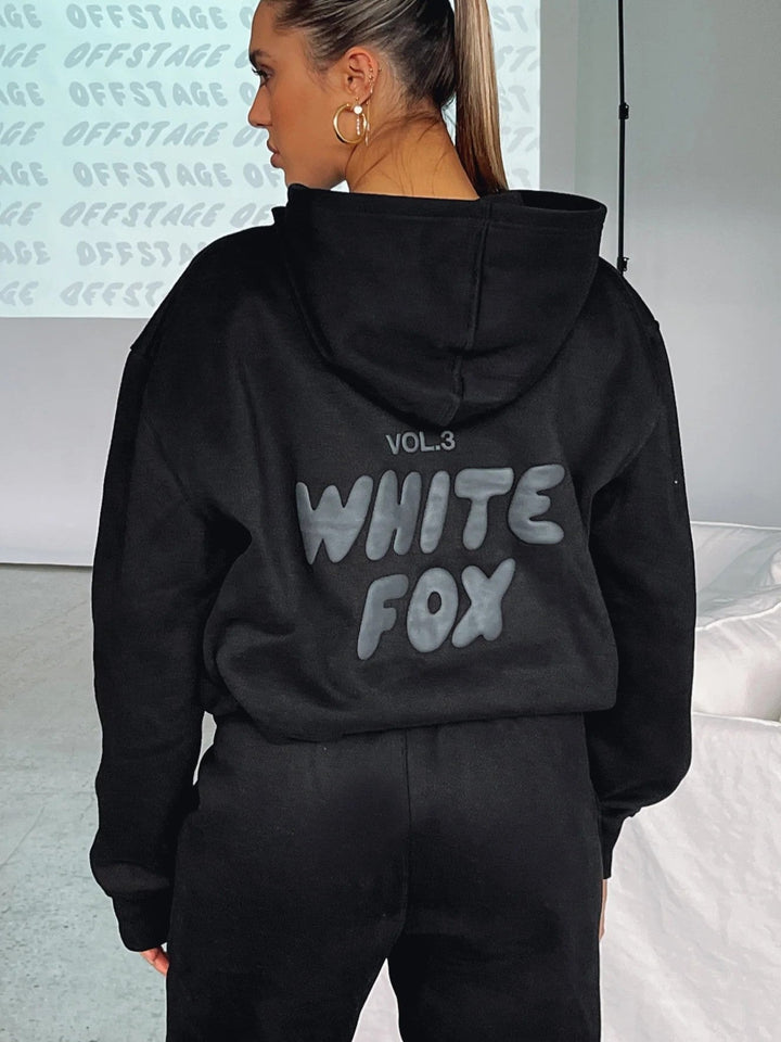 Modern women's cropped tracksuit set, ideal for casual wear or loungewear. Features a trendy back print on hoodie & joggers.