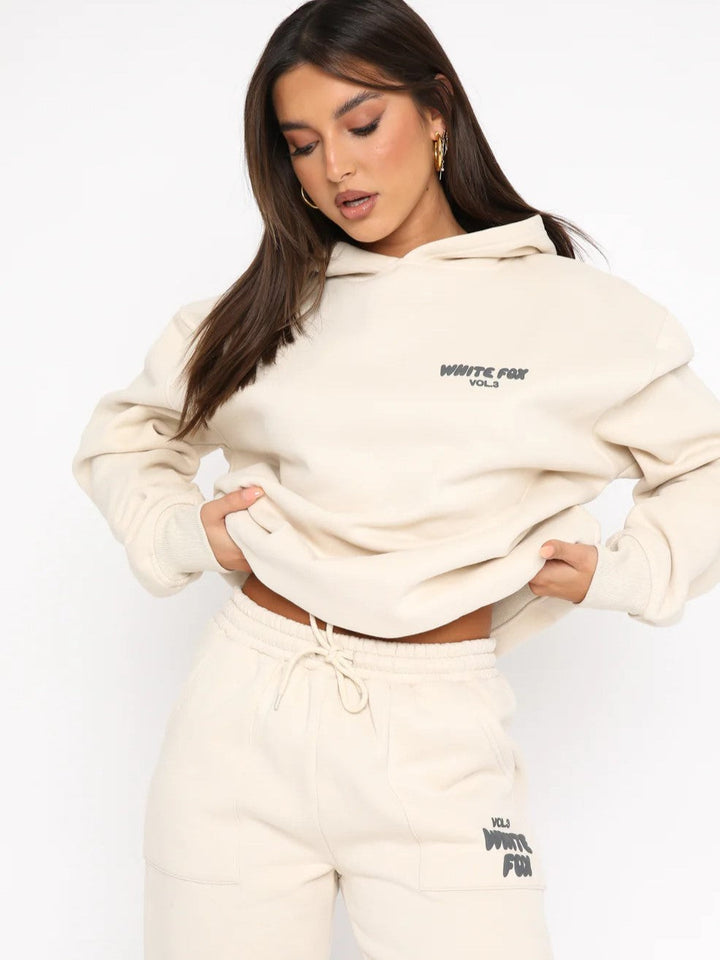 Comfortable women's two-piece loungewear set; cropped hoodie & joggers with stylish back print.