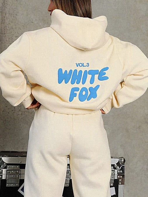 Versatile women's cropped tracksuit, ideal for loungewear or active lifestyle, showcasing a unique back graphic.