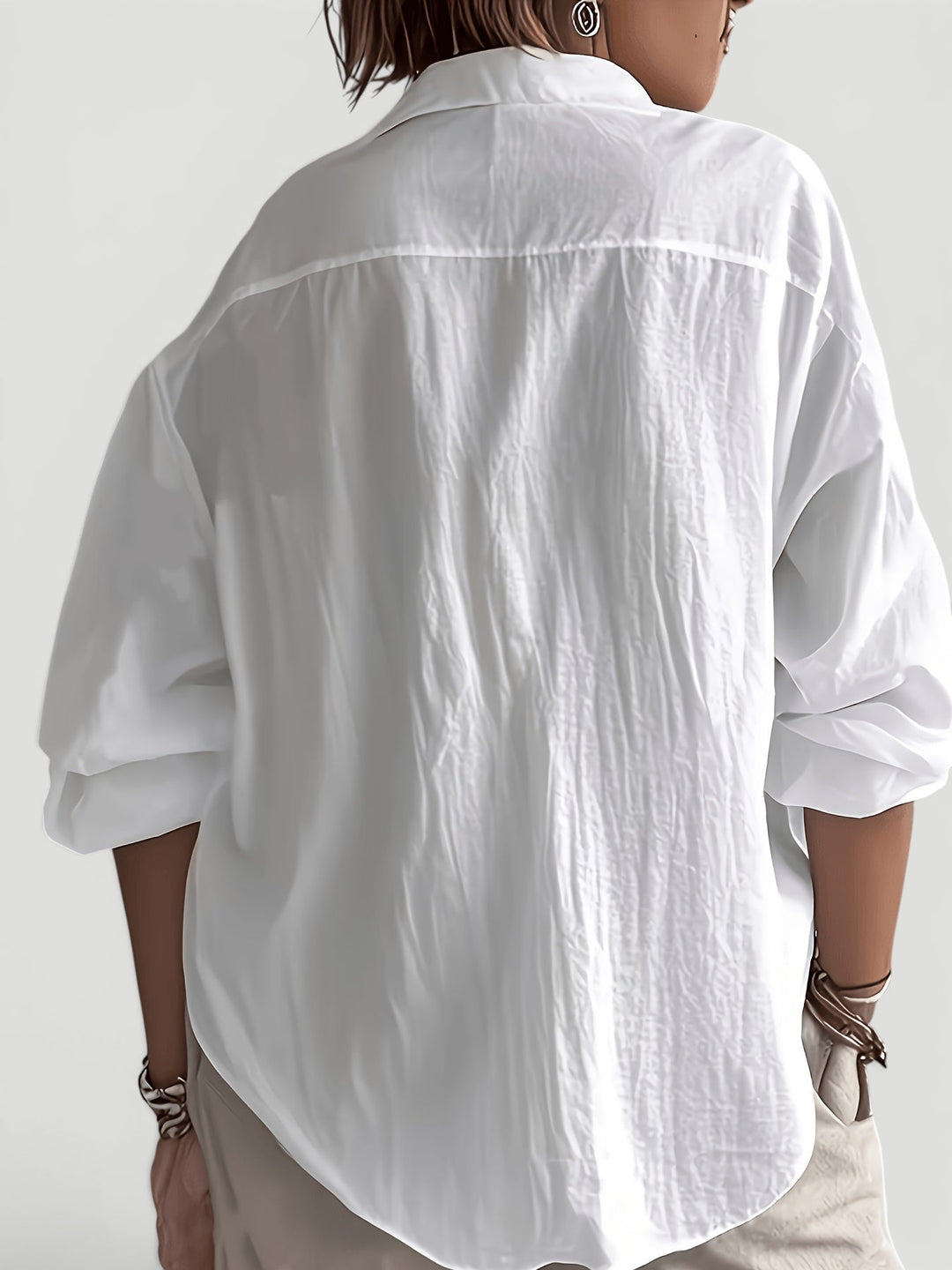 Women's casual elegant blouse, a relaxed fit button-up shirt offering chic sophistication for everyday wear.