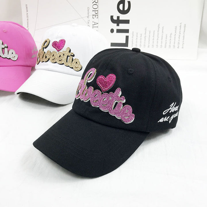 Women's casual embroidered baseball cap with adjustable strap, perfect for sun protection & fashion accessory.