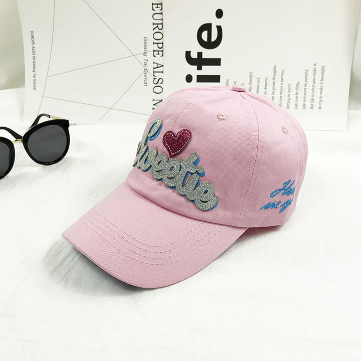 Stylish women's cotton baseball cap featuring unique embroidery, adjustable fit for casual wear & sun protection.