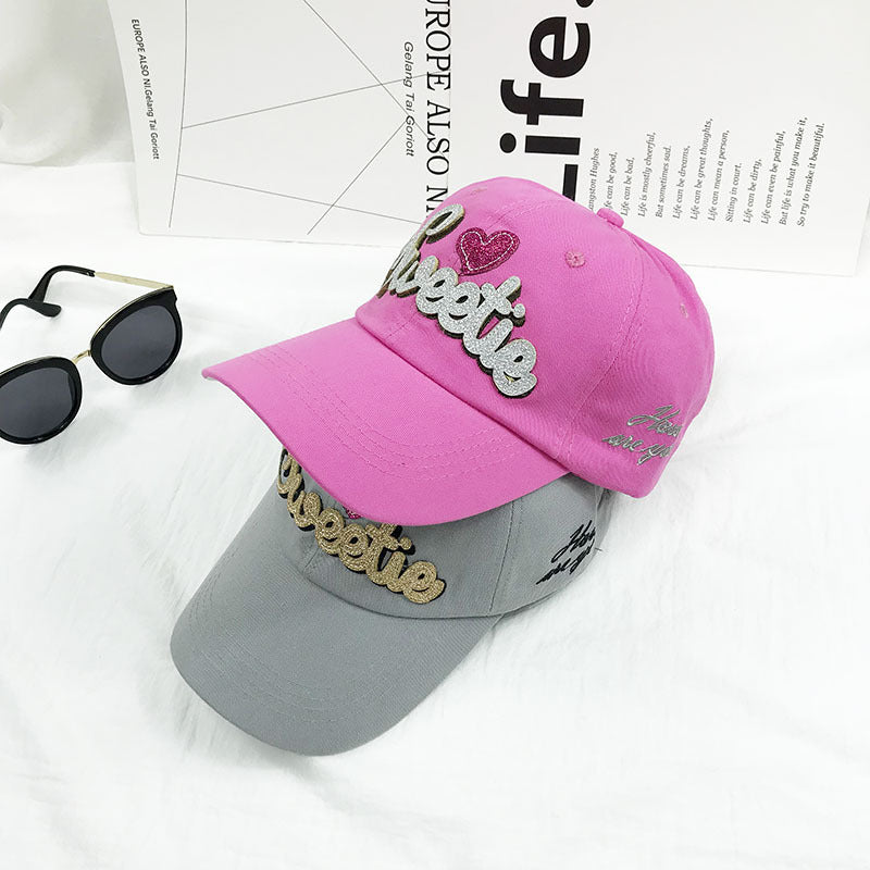 Women's adjustable baseball cap with sweetie embroidery, ideal for outdoor activities, sun protection & style.