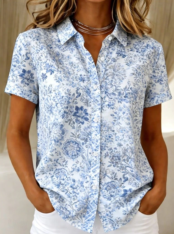 Vibrant floral button-up short sleeve shirt for women, a casual summer & spring fashion blouse.