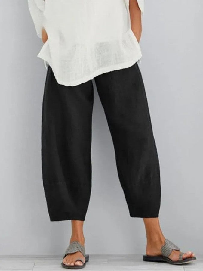 Stylish dark blue women's cropped trousers, loose fit for effortless casual wear and versatile everyday fashion.
