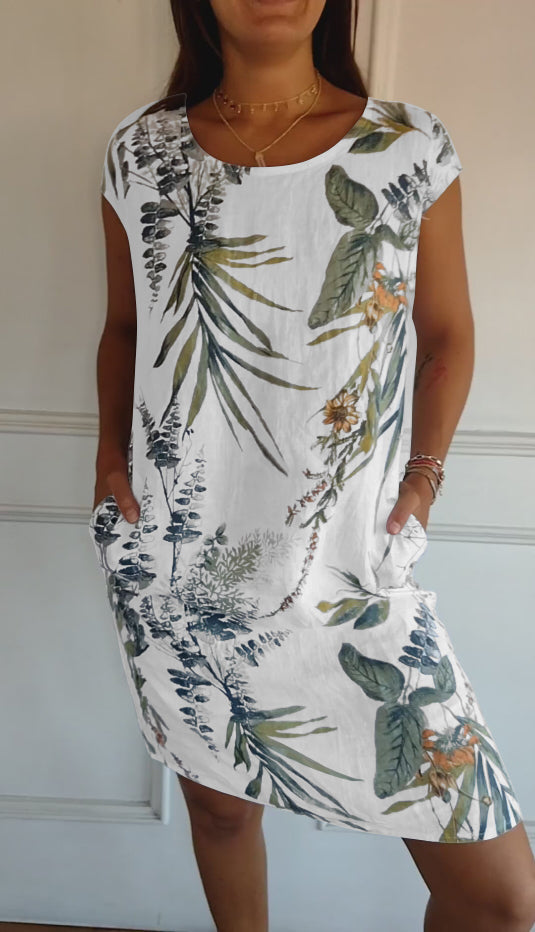 Women's casual leaf print midi summer dress with practical pockets, short sleeves, and a flattering V-neck for vacation.