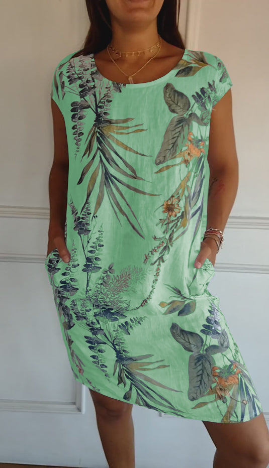 Perfect vacation outfit: women's casual leaf print midi summer dress, short sleeve, V-neck, and practical pockets.