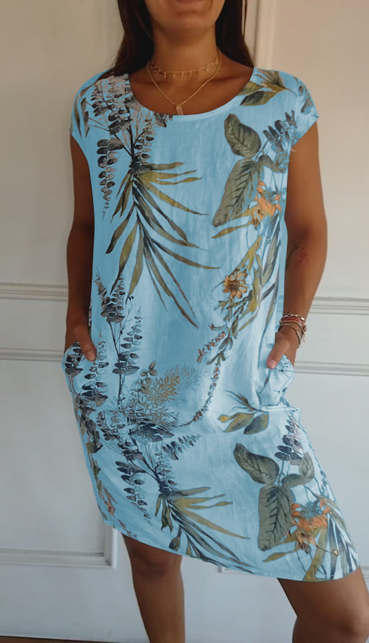Women's casual leaf print short sleeve midi summer dress with handy pockets, a comfortable and stylish V-neck design.