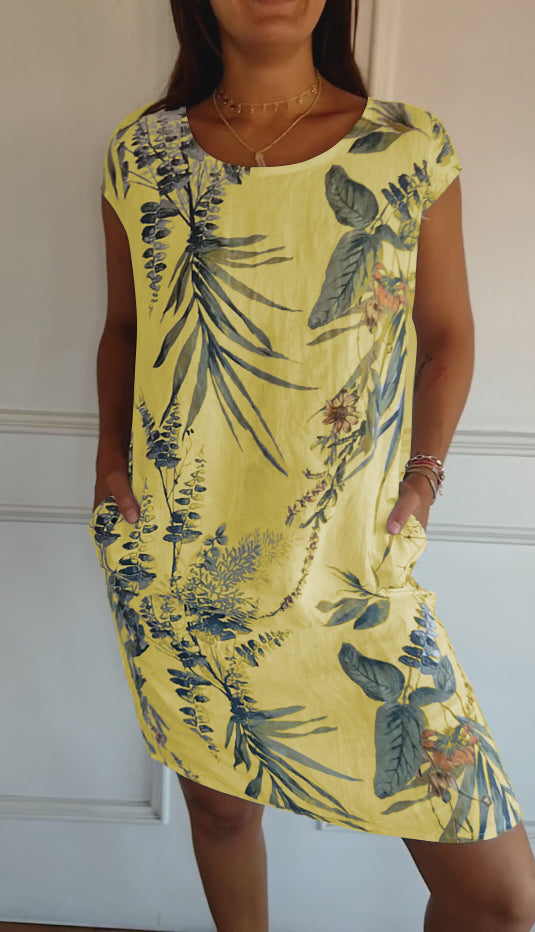 Versatile women's leaf print midi summer dress, short sleeve, V-neck, and pockets, suitable for casual everyday wear.