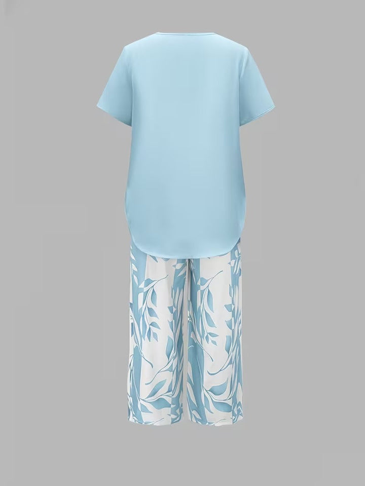 Women's comfortable two-piece leaf print summer outfit, great for relaxed vacation style.