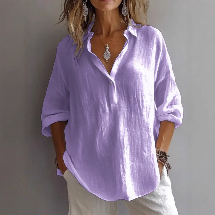 Chic casual women's shirt with comfortable wide sleeves and button closure.