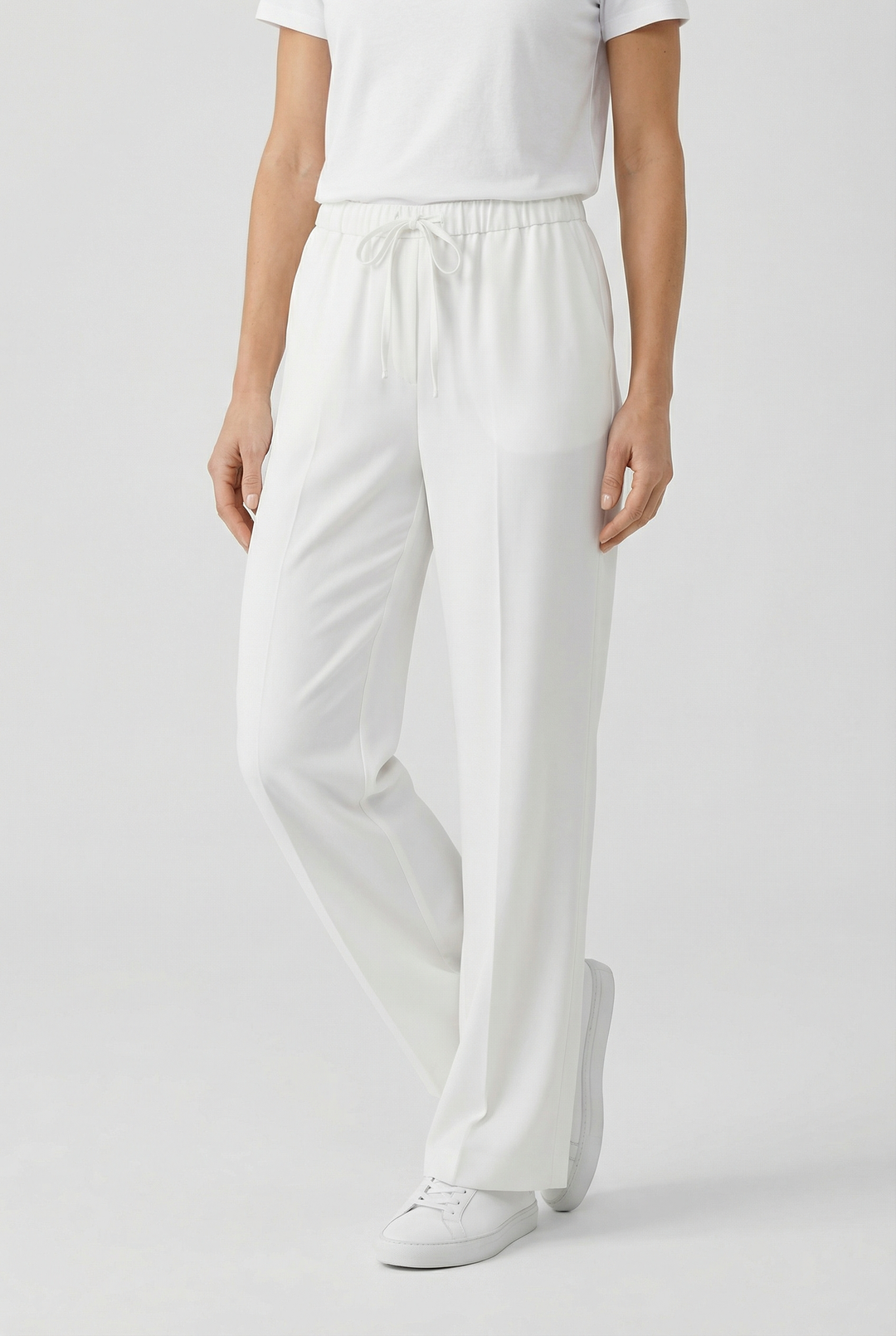 Comfortable women's linen pants with a relaxed, lace-up design for casual outings.