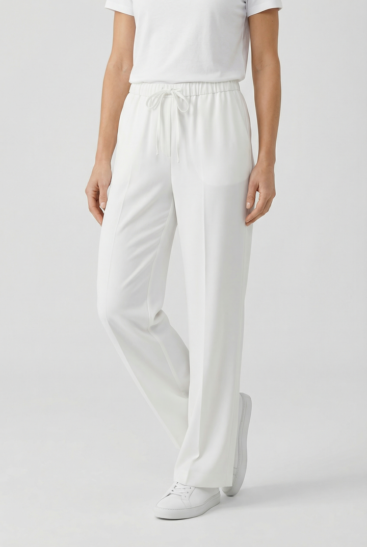 Comfortable women's linen pants with a relaxed, lace-up design for casual outings.