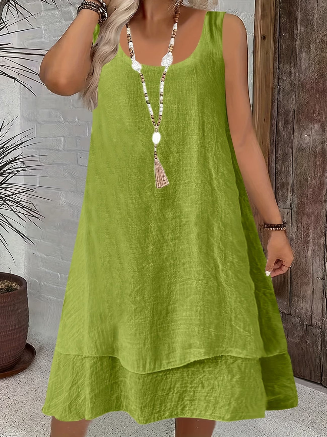 Chic pink sleeveless dress for ladies, a versatile and comfortable flowy option for relaxed summer days.