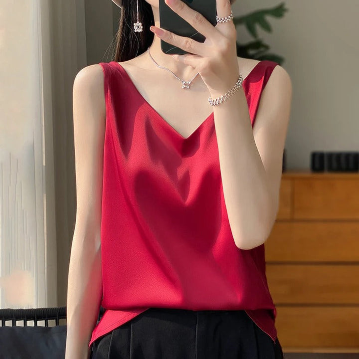 Comfortable women's loose-fit sleeveless blouse with a deep V-neck, perfect for casual spring & summer outfits.