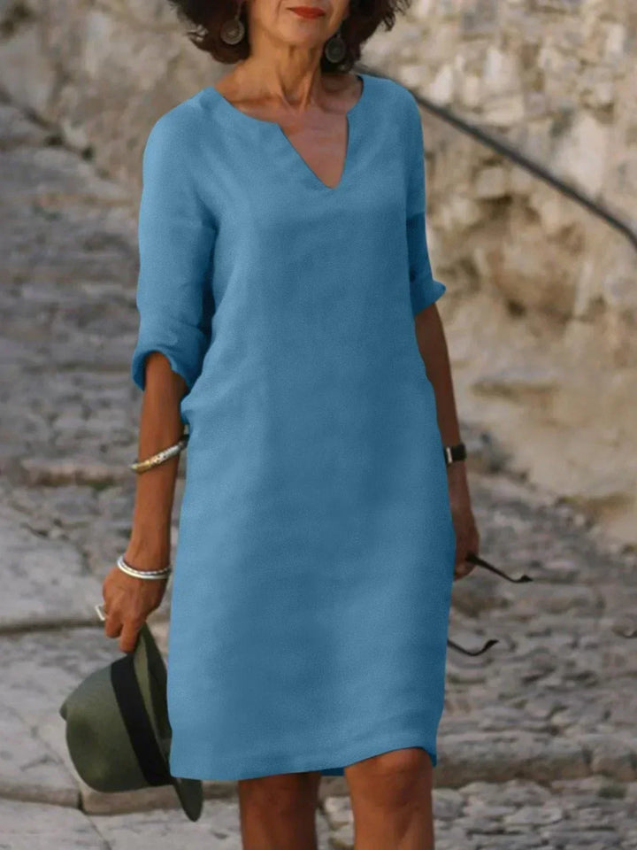 Chic women's mid sleeve V-neck dress, offering an effortless, versatile and flattering casual outfit.