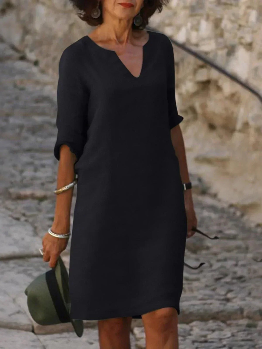 Elegant women's mid sleeve V-neck A-line dress, offering a flattering fit for various occasions.