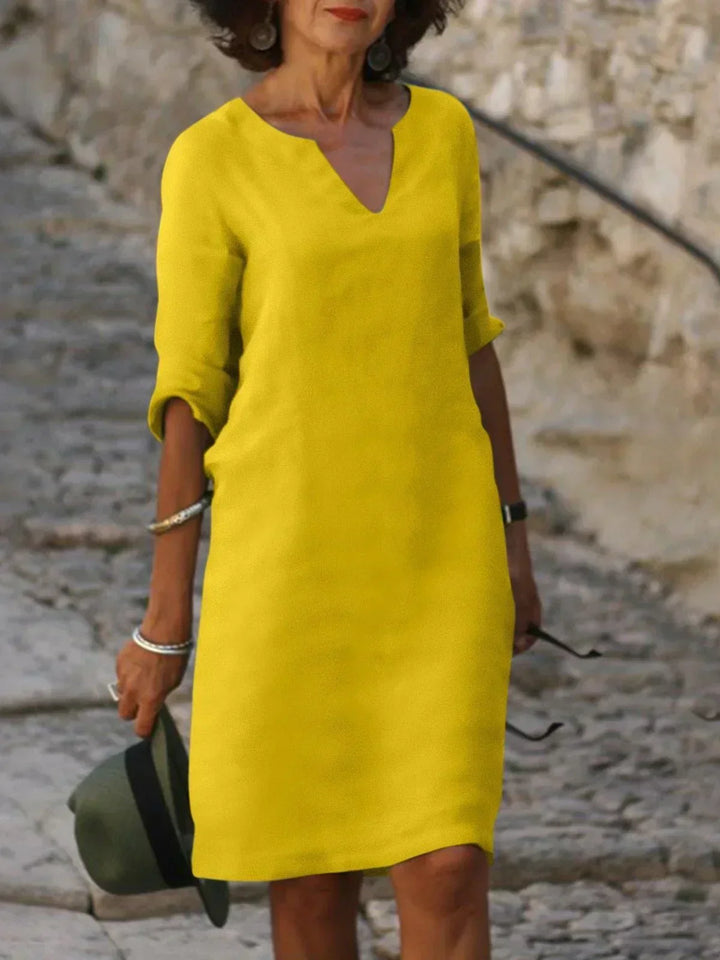 Casual women's V-neck dress with mid sleeves, featuring an effortless style and flattering fit.