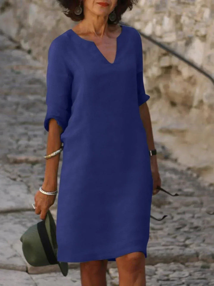 Women's elegant A-line V-neck dress with comfortable mid sleeves, perfect for everyday chic.