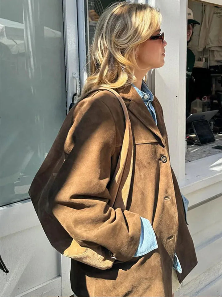 Stylish brown oversized women's blazer, a comfortable and chic outerwear jacket.
