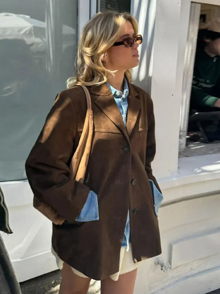 Modern women's oversized brown blazer jacket, an essential layering piece for contemporary fashion.