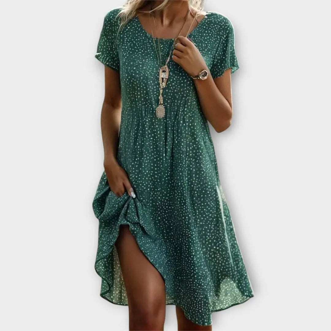 Women's casual polka dot flowy short sleeve A-line midi dress, perfect for summer vacation or spring fashion.