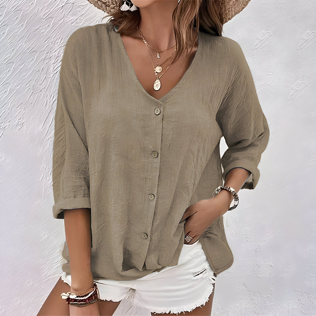 Stylish women's relaxed button-up blouse, a comfortable V-neck top ideal for versatile casual spring fashion.